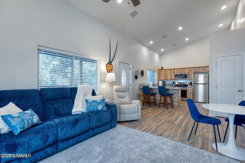 2145 Cottontail Road Overgaard, AZ 85933 - Photo 10 of 22 a living room with furniture and a large window