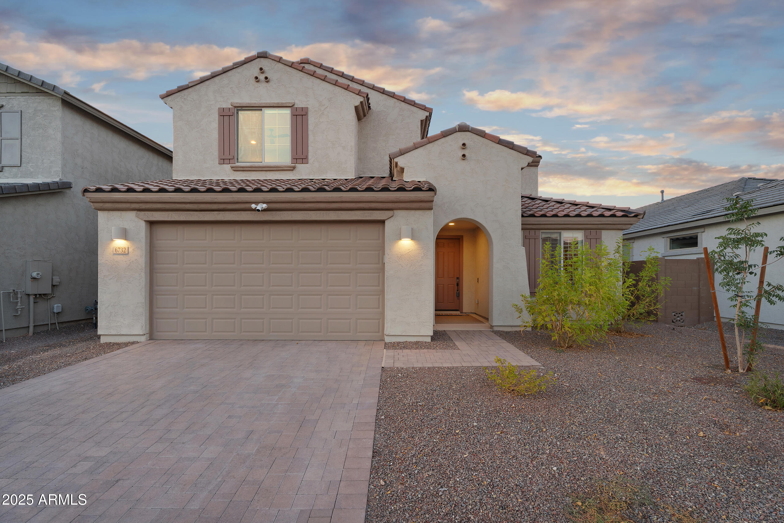 a view of a house with a outdoor space and garage