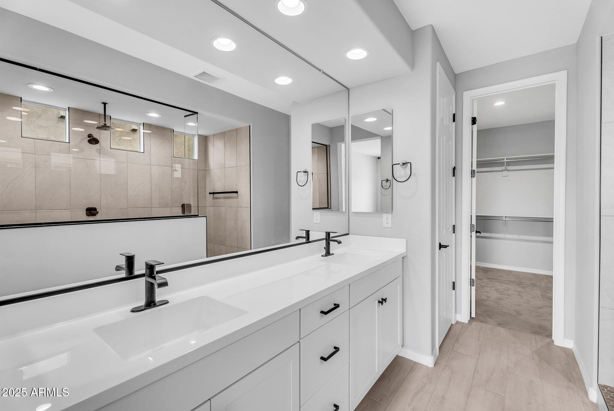 6732 West Coles Road Laveen, AZ 85339 - Photo 13 of 41 a bathroom with a double vanity sink mirror and double