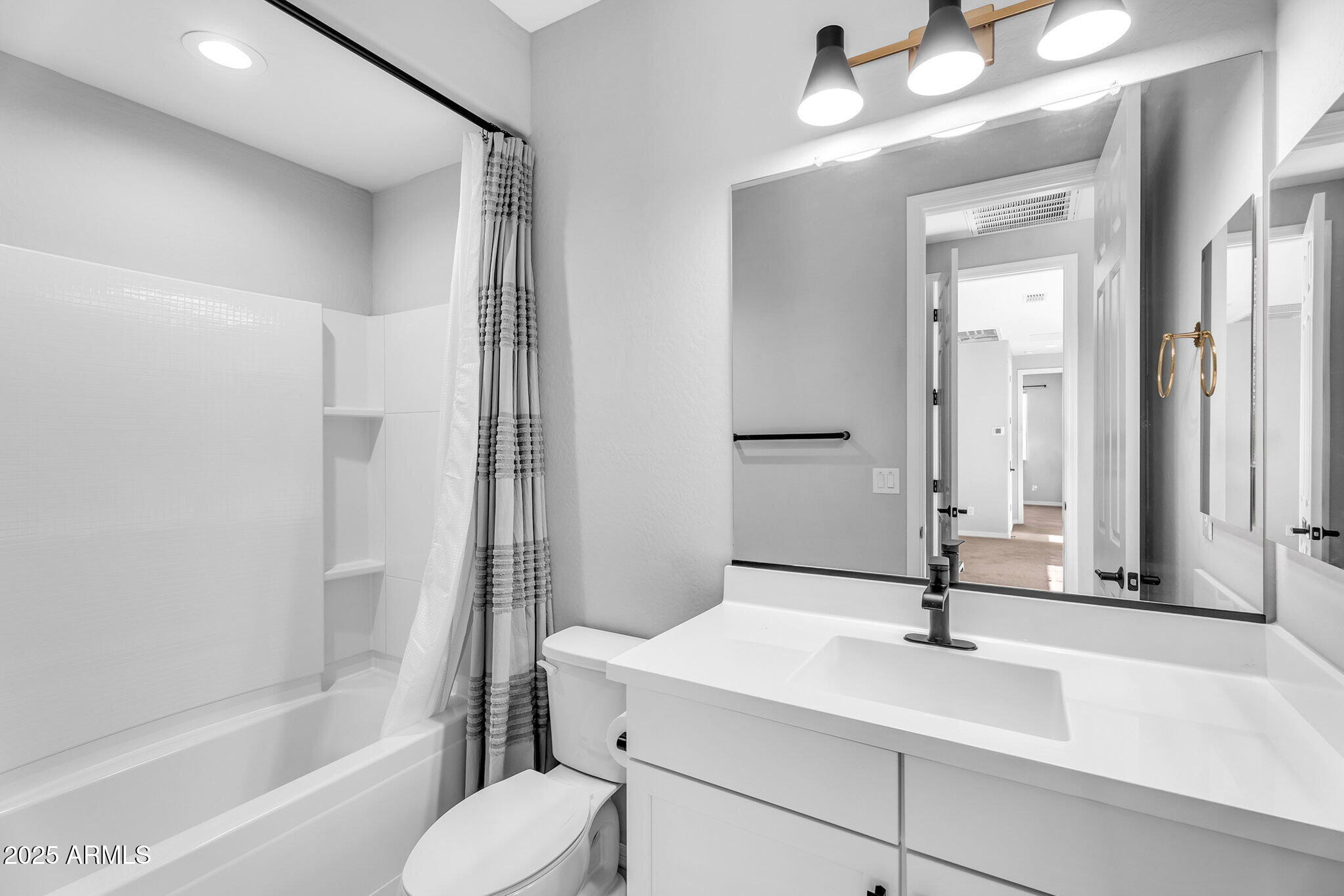 6732 West Coles Road Laveen, AZ 85339 - Photo 20 of 41 a bathroom with a sink vanity granite tub and a mirror