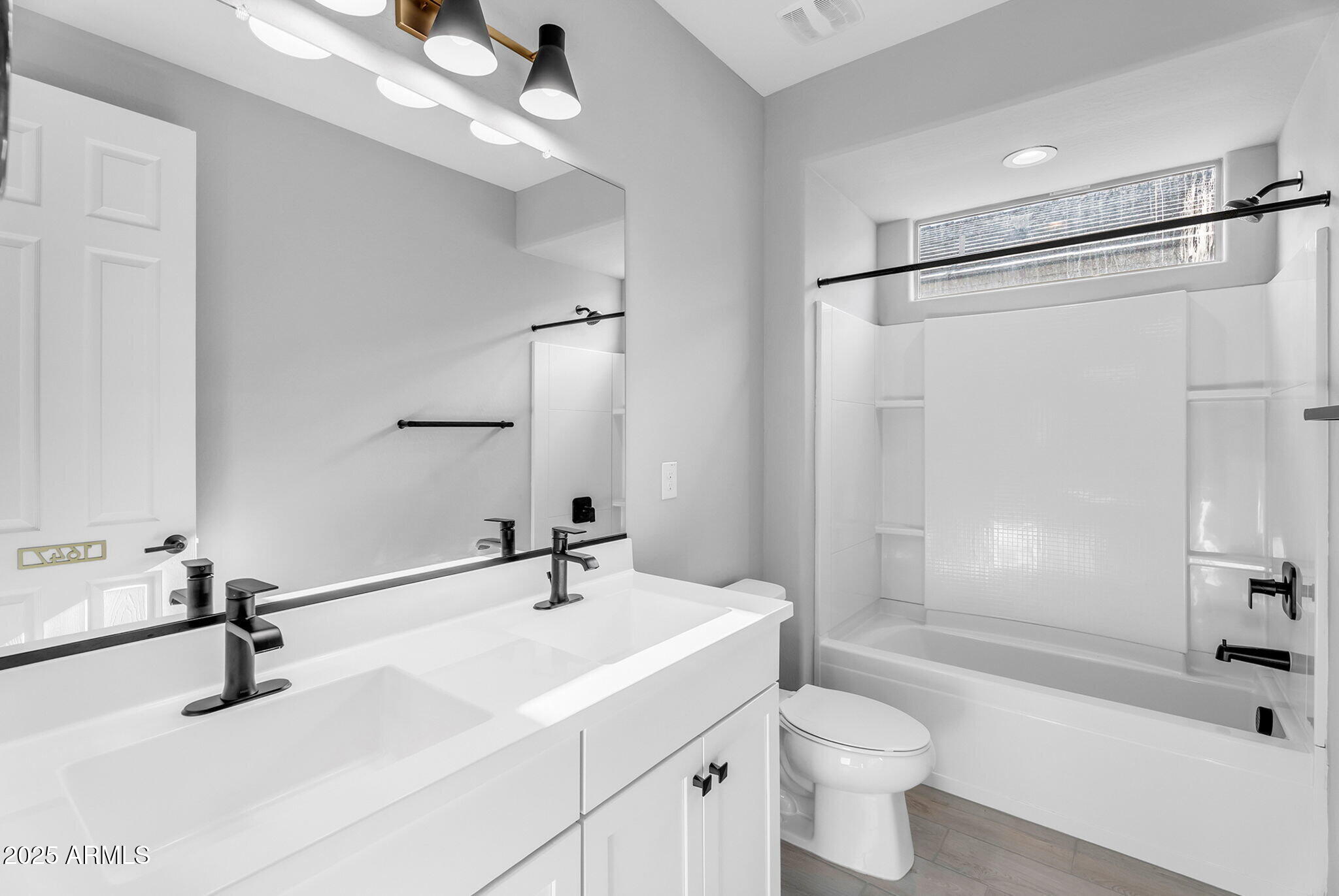 6732 West Coles Road Laveen, AZ 85339 - Photo 24 of 41 a bathroom with a sink toilet a mirror and shower