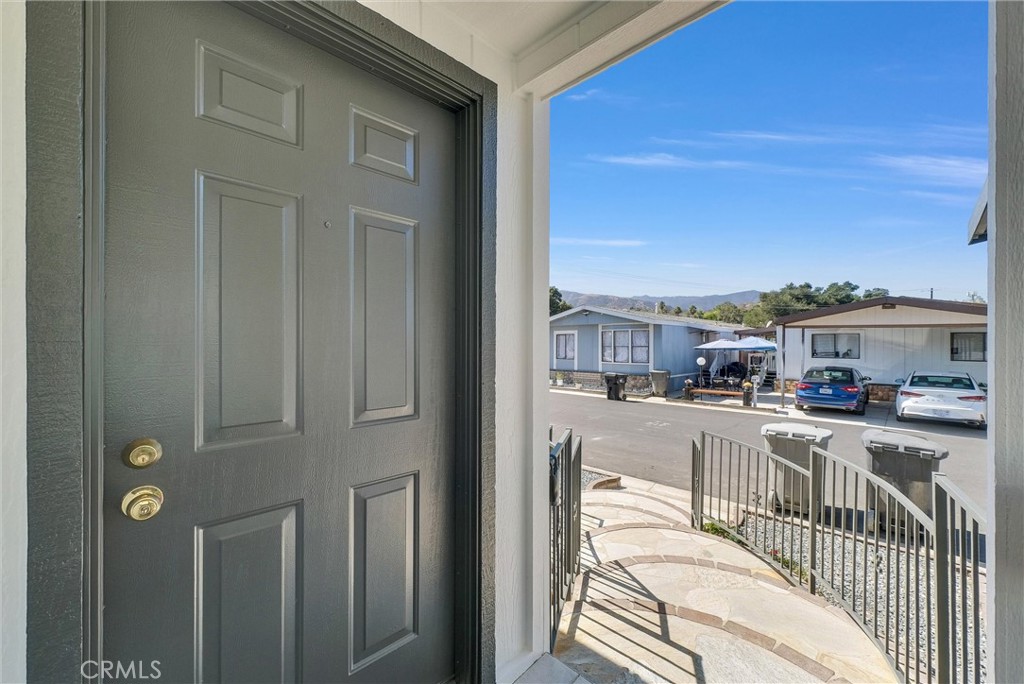 21650 Temescal Canyon Road, Unit 26 Corona, CA 92883 - Photo 11 of 32 a view of a kitchen with furniture and a window