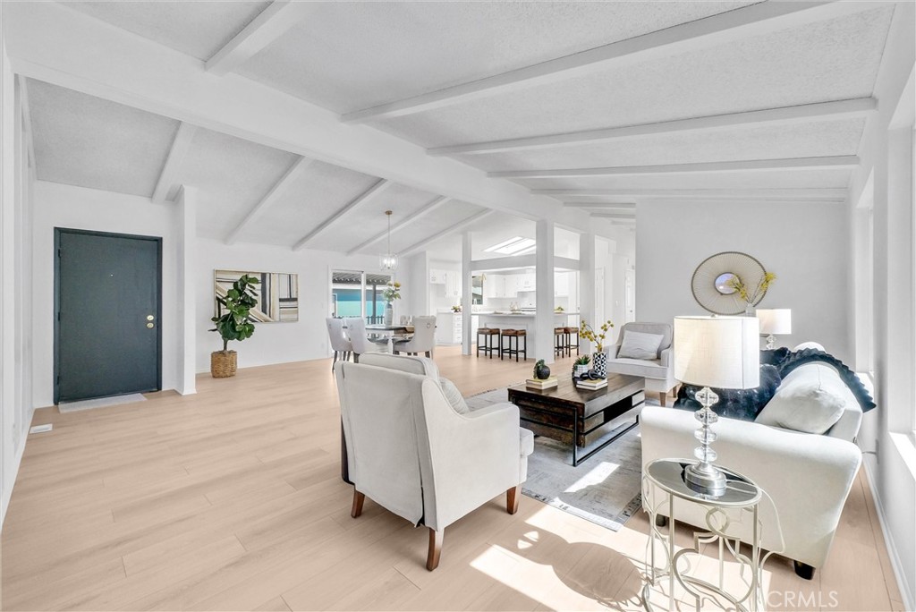 21650 Temescal Canyon Road, Unit 26 Corona, CA 92883 - Photo 14 of 32 a living room with furniture and wooden floor