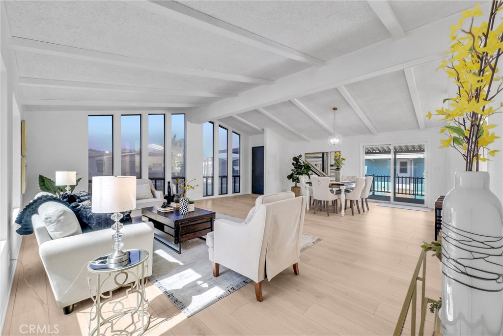 21650 Temescal Canyon Road, Unit 26 Corona, CA 92883 - Photo 15 of 32 a living room with furniture and a large window