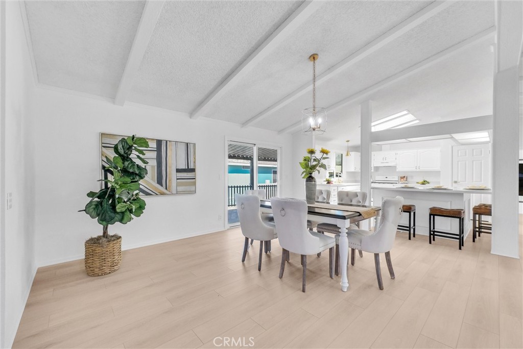 21650 Temescal Canyon Road, Unit 26 Corona, CA 92883 - Photo 16 of 32 a view of a dining room with furniture