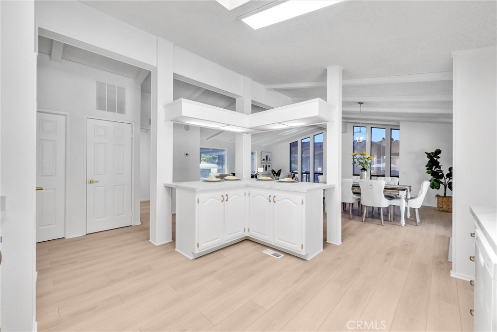 21650 Temescal Canyon Road, Unit 26 Corona, CA 92883 - Photo 19 of 32 a view of kitchen with table and chairs