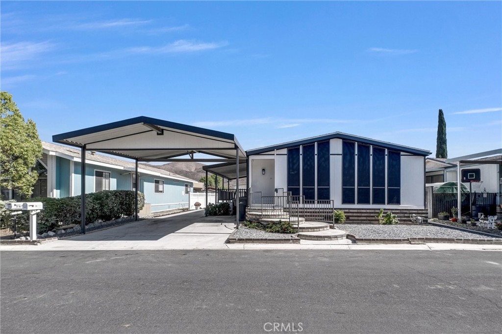 21650 Temescal Canyon Road, Unit 26 Corona, CA 92883 - Photo 5 of 32 a view of building with street view