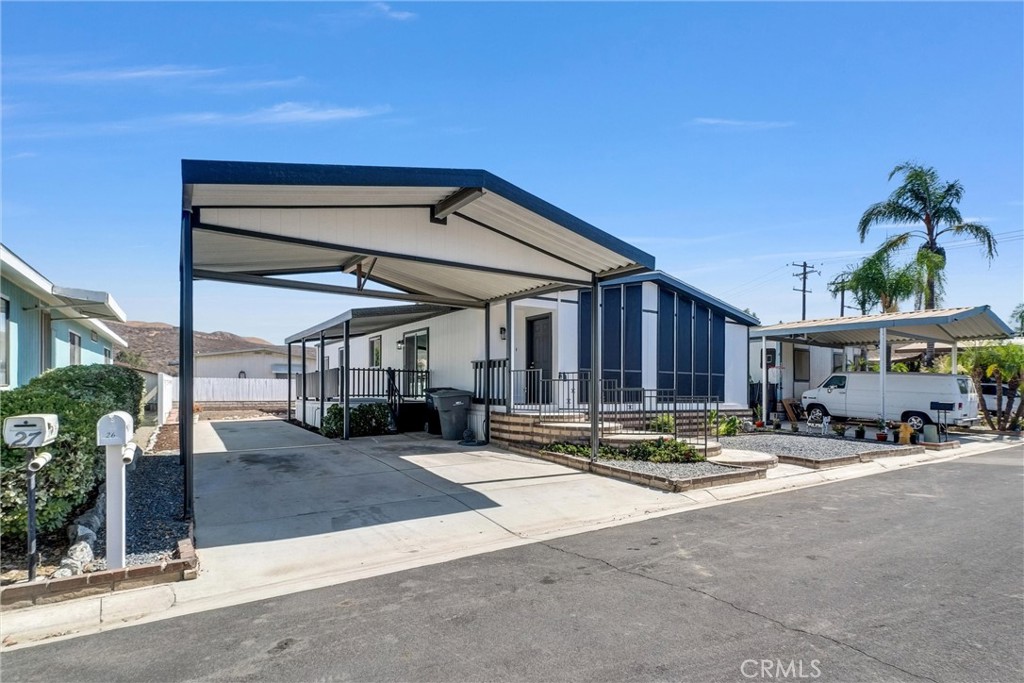 21650 Temescal Canyon Road, Unit 26 Corona, CA 92883 - Photo 6 of 32 a car parked in front of building