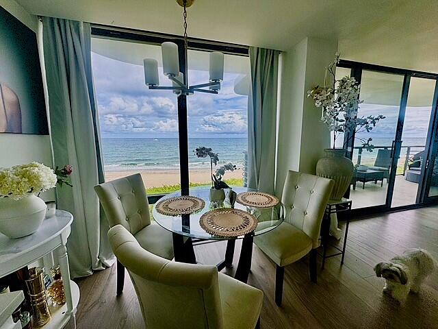 250 South Ocean Boulevard, Unit 2A Boca Raton, FL 33432 - Photo 2 of 15 a dining room with furniture and wooden floor