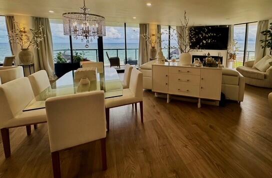 250 South Ocean Boulevard, Unit 2A Boca Raton, FL 33432 - Photo 3 of 15 a living room with furniture and a chandelier