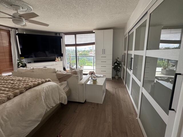 250 South Ocean Boulevard, Unit 2A Boca Raton, FL 33432 - Photo 5 of 15 a living room with furniture and a flat screen tv