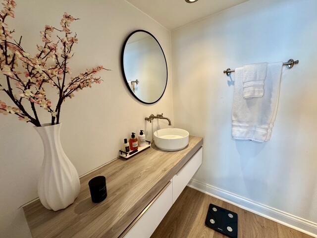 250 South Ocean Boulevard, Unit 2A Boca Raton, FL 33432 - Photo 6 of 15 a bathroom with a sink and a mirror