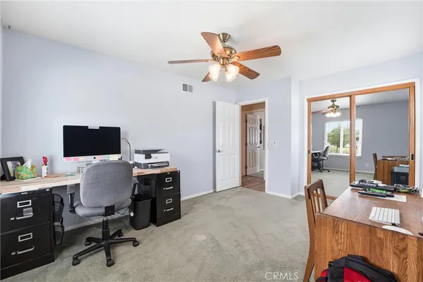 a view of a workspace with furniture