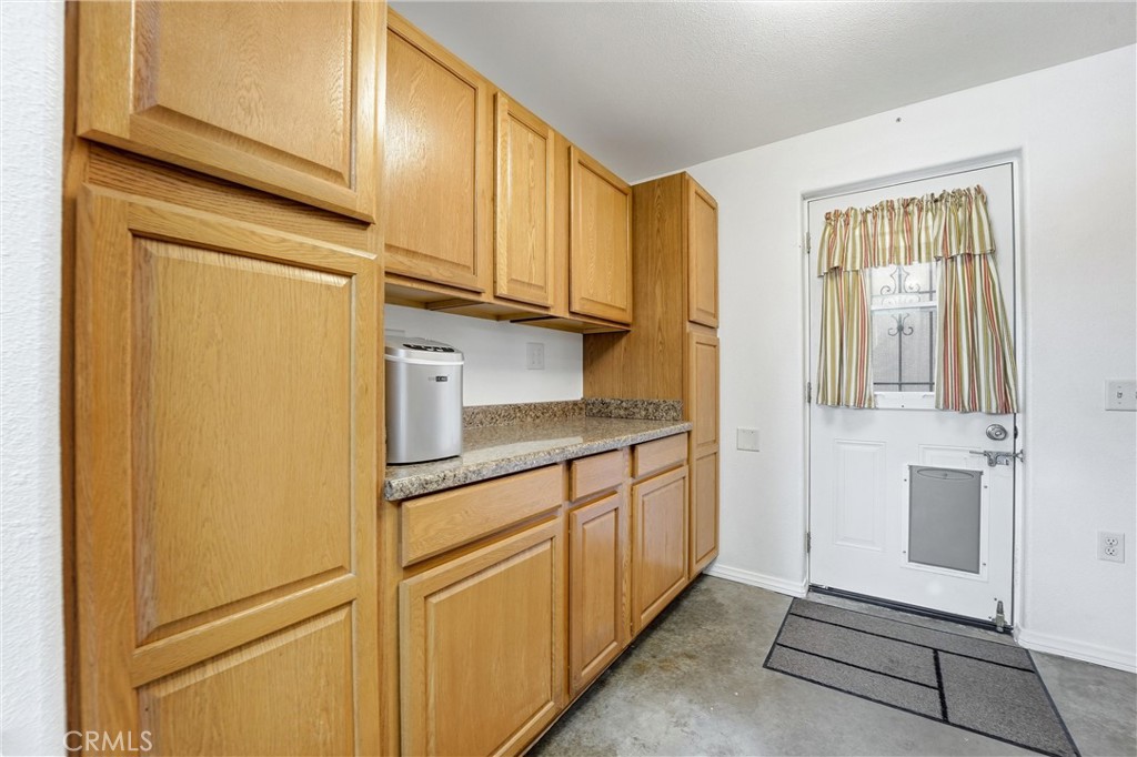 544 Firethorne Street Brea, CA 92821 - Photo 30 of 39 Laundry Room with additional storage and door that leads to the side yard!