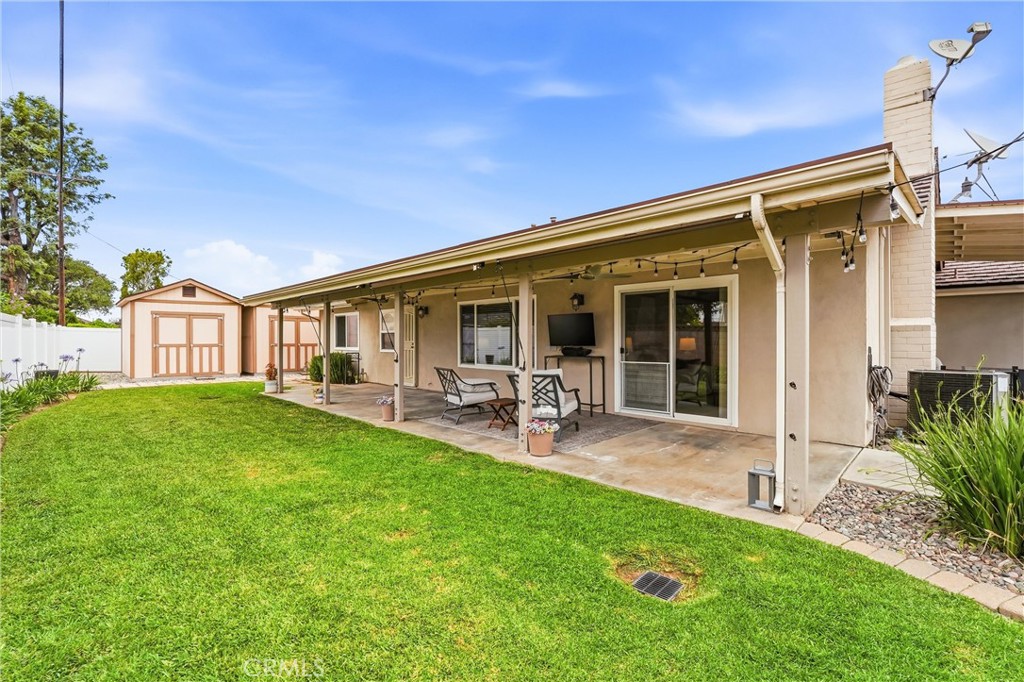 544 Firethorne Street Brea, CA 92821 - Photo 35 of 39 Grass area with views of the covered patio! Outdoor TV and sitting area provides addtional options to enjoy the game or host a party!