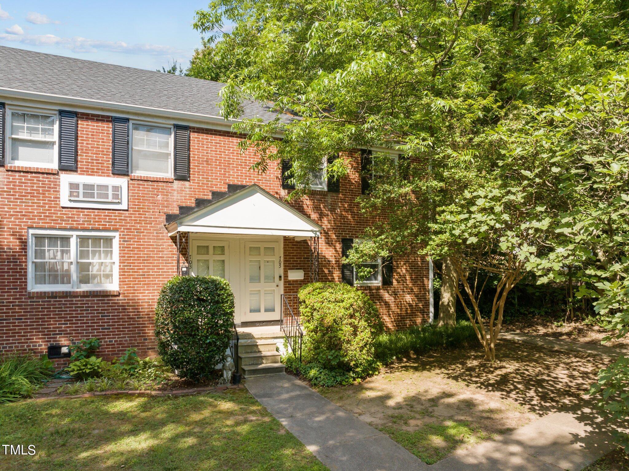 705 Bryan Street Raleigh, NC 27605 - Photo 31 of 42 a front view of a house with garden