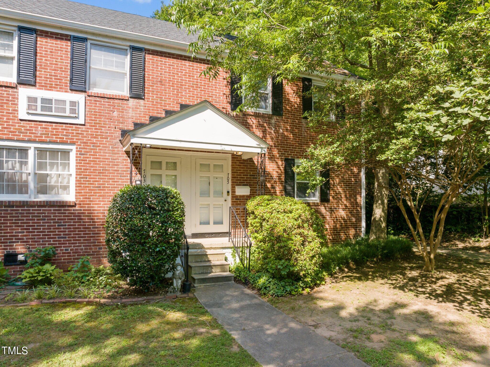 705 Bryan Street Raleigh, NC 27605 - Photo 32 of 42 a front view of a house with garden