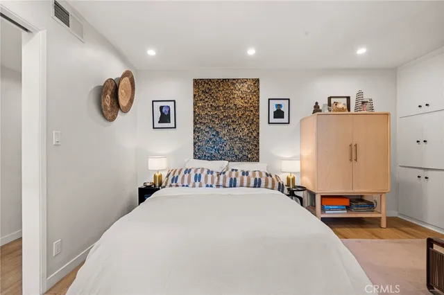 a bedroom with bed and a window