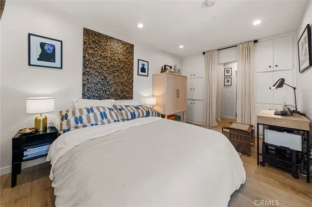 a bed room with a bed and a lamp