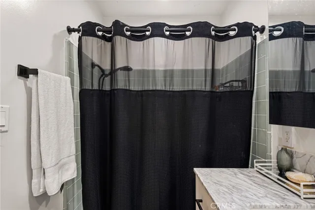 a bathroom with a bathtub and shower