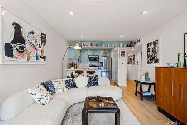 a living room with furniture and large window