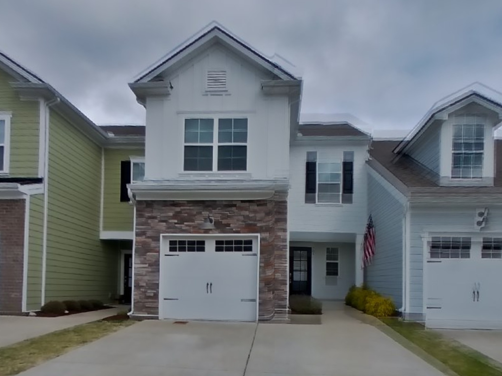 704 Finse Drive Spring Hill, TN 37174 - Photo 1 of 16 a front view of a house with a garage