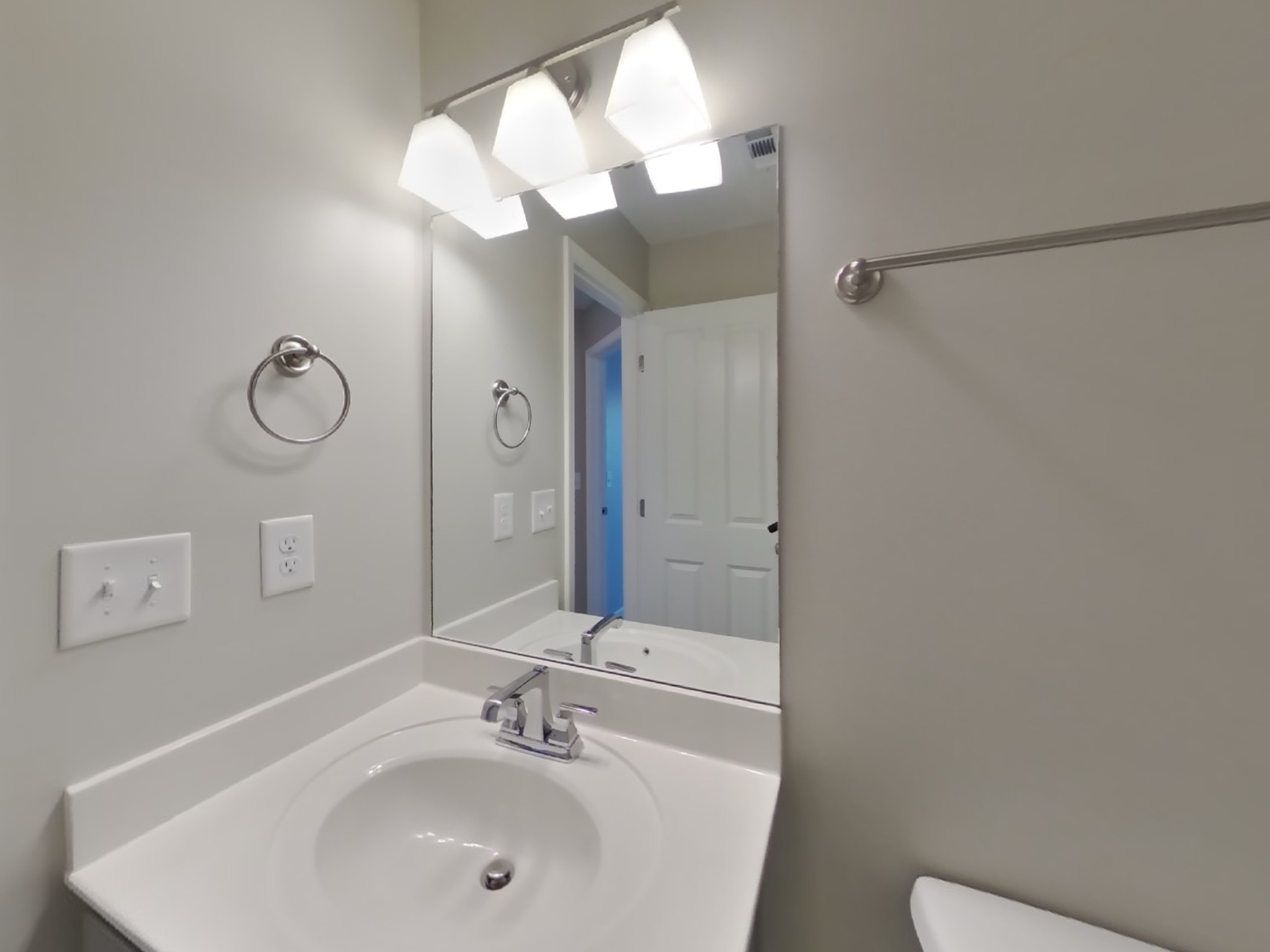 704 Finse Drive Spring Hill, TN 37174 - Photo 14 of 16 a bathroom with a sink a light fixture and a mirror