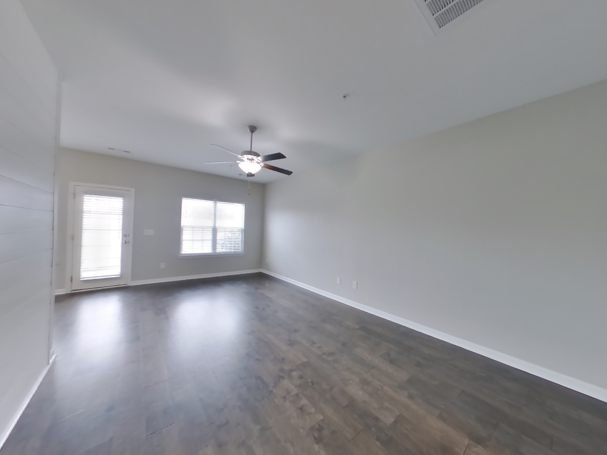 704 Finse Drive Spring Hill, TN 37174 - Photo 3 of 16 wooden floor in an empty room with a window