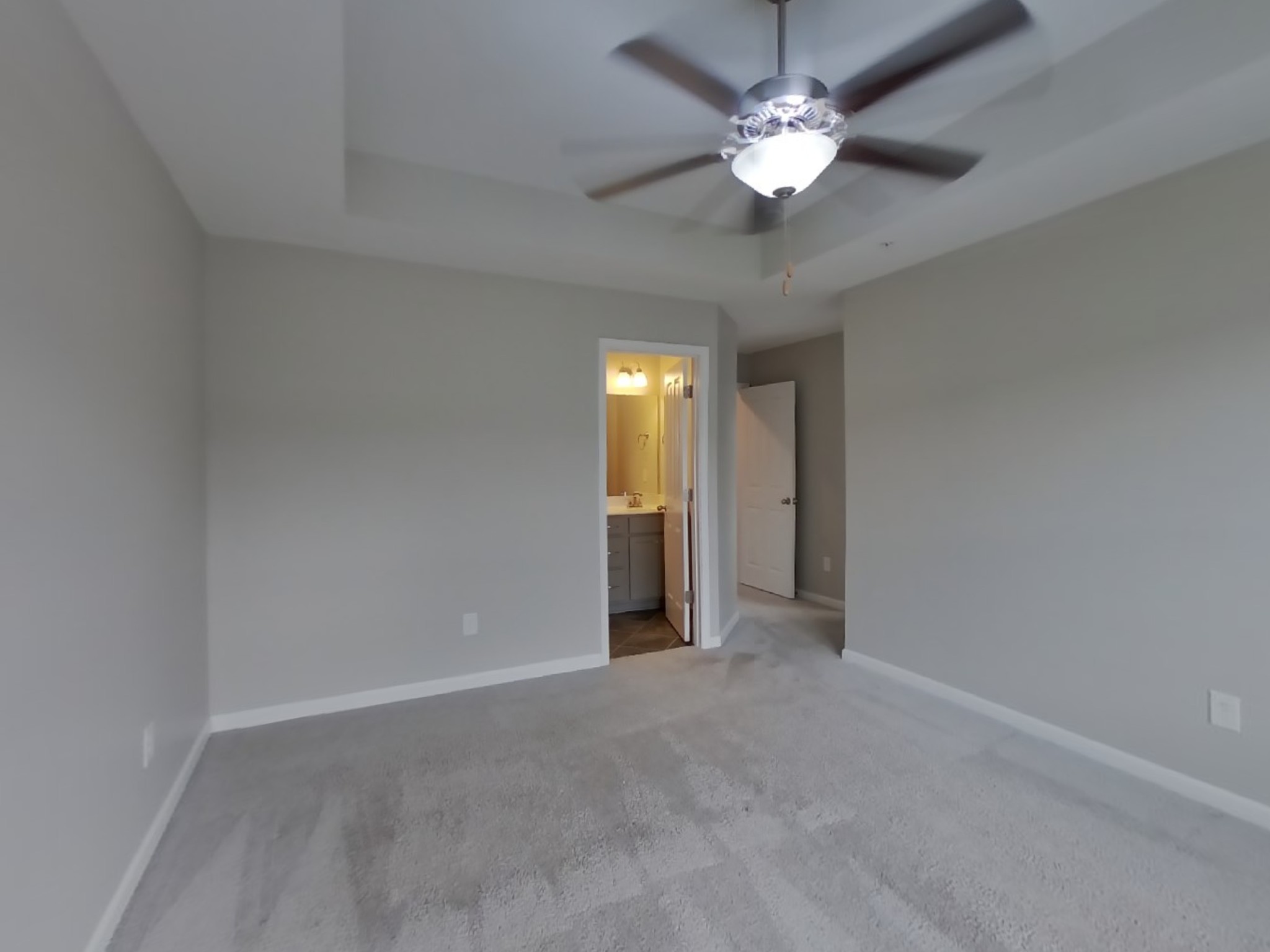 704 Finse Drive Spring Hill, TN 37174 - Photo 7 of 16 a view of an empty room with a ceiling fan