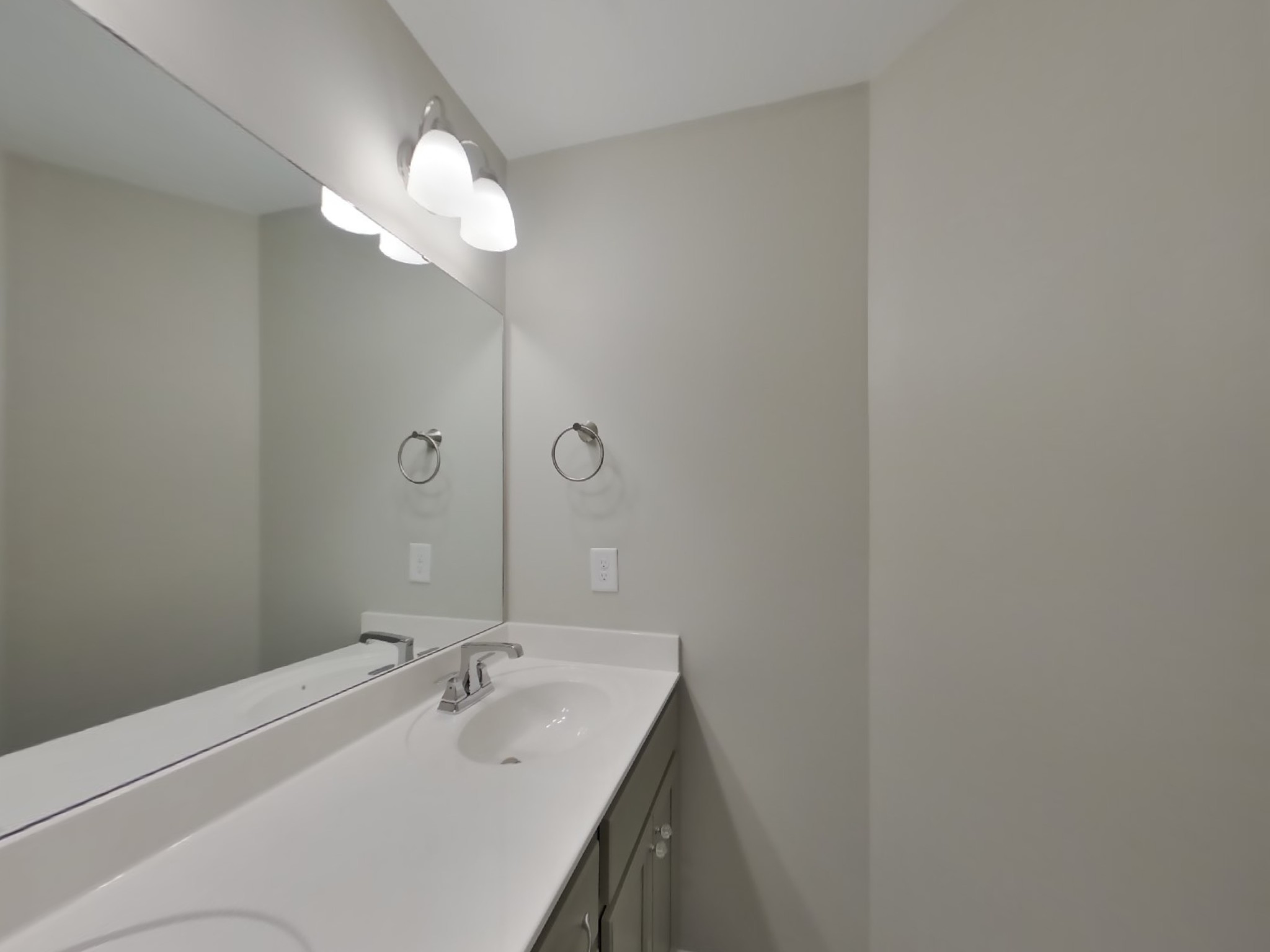 704 Finse Drive Spring Hill, TN 37174 - Photo 8 of 16 a bathroom with a sink and a mirror