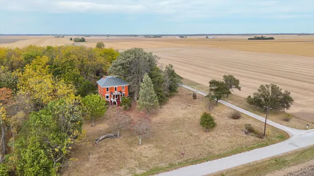 a front view of house with a garden