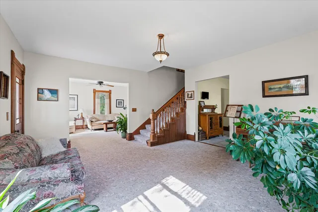 a bedroom with furniture and a flat screen tv