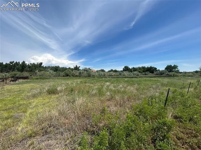 a view of a lake with houses in the back