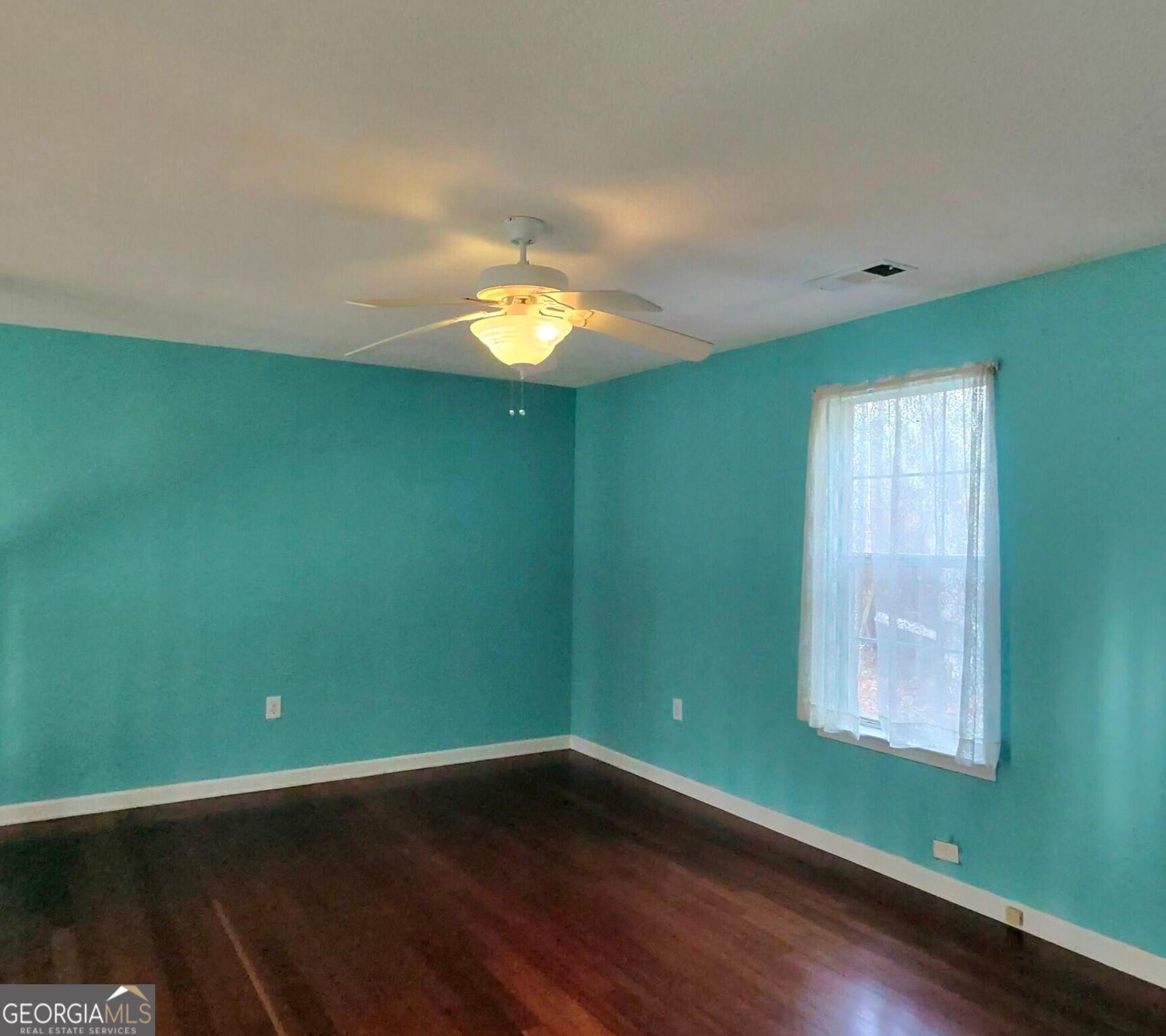 173 Preston Road Byron, GA 31008 - Photo 12 of 22 a view of a room with wooden floor and windows