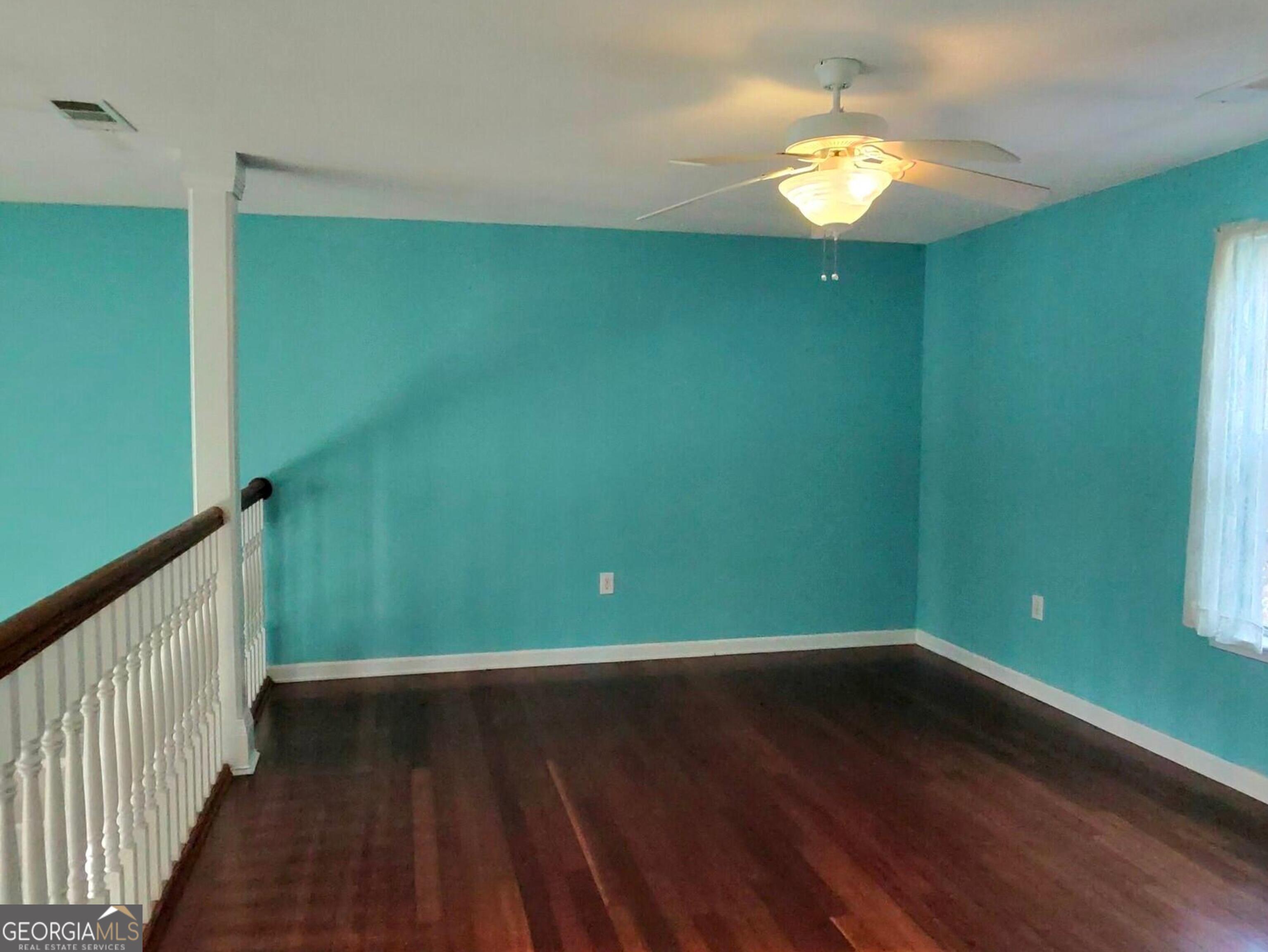 173 Preston Road Byron, GA 31008 - Photo 13 of 22 a view of a room with wooden floor and a window
