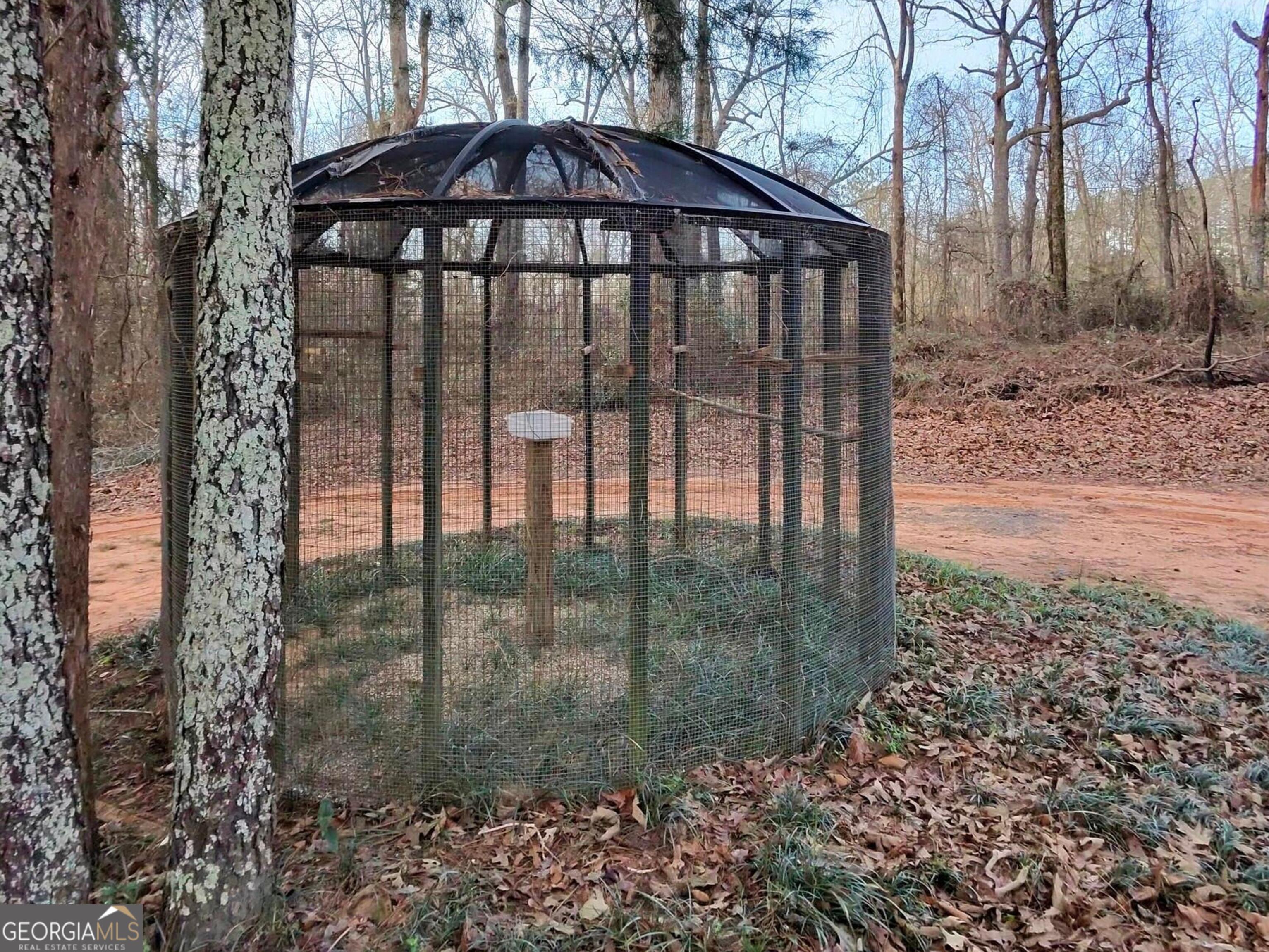 173 Preston Road Byron, GA 31008 - Photo 21 of 22 a view of a wooden fence next to a large tree