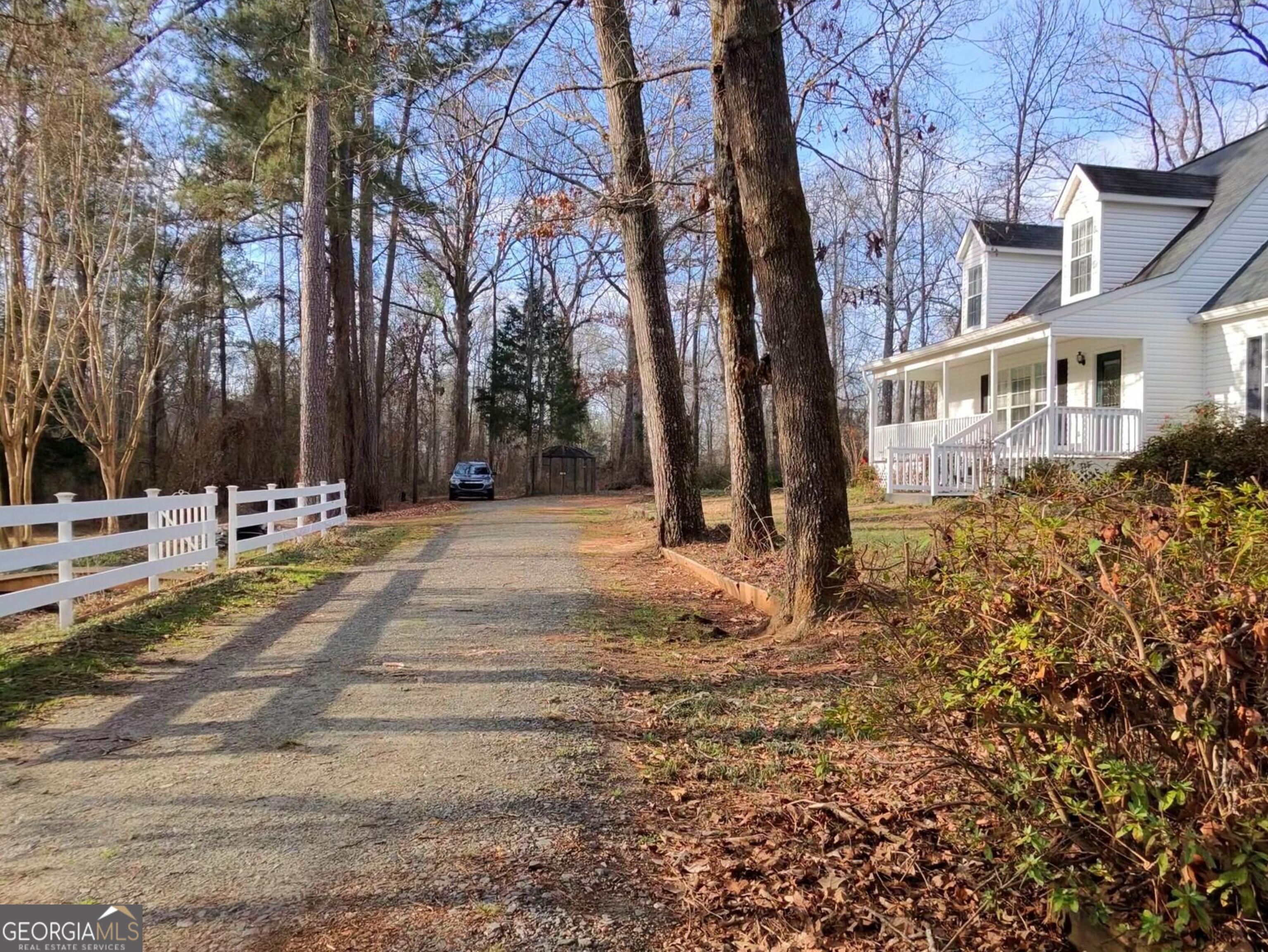 173 Preston Road Byron, GA 31008 - Photo 3 of 22 a view of road with large trees