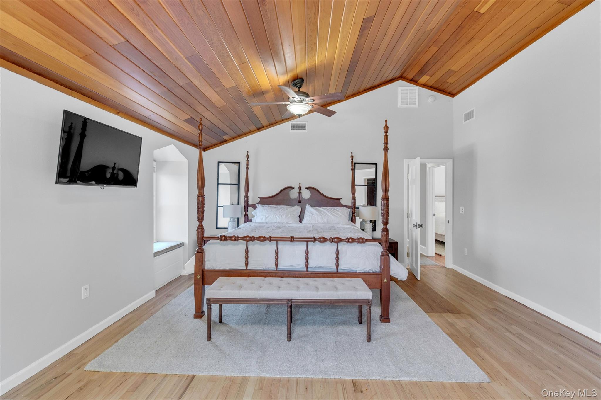 345 Colonial Road Southold, NY 11971 - Photo 19 of 31 a living room with furniture and a flat screen tv