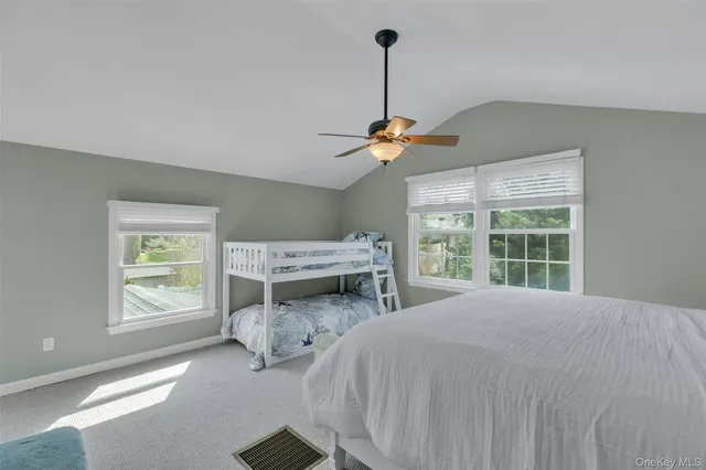 a bedroom with furniture and a window