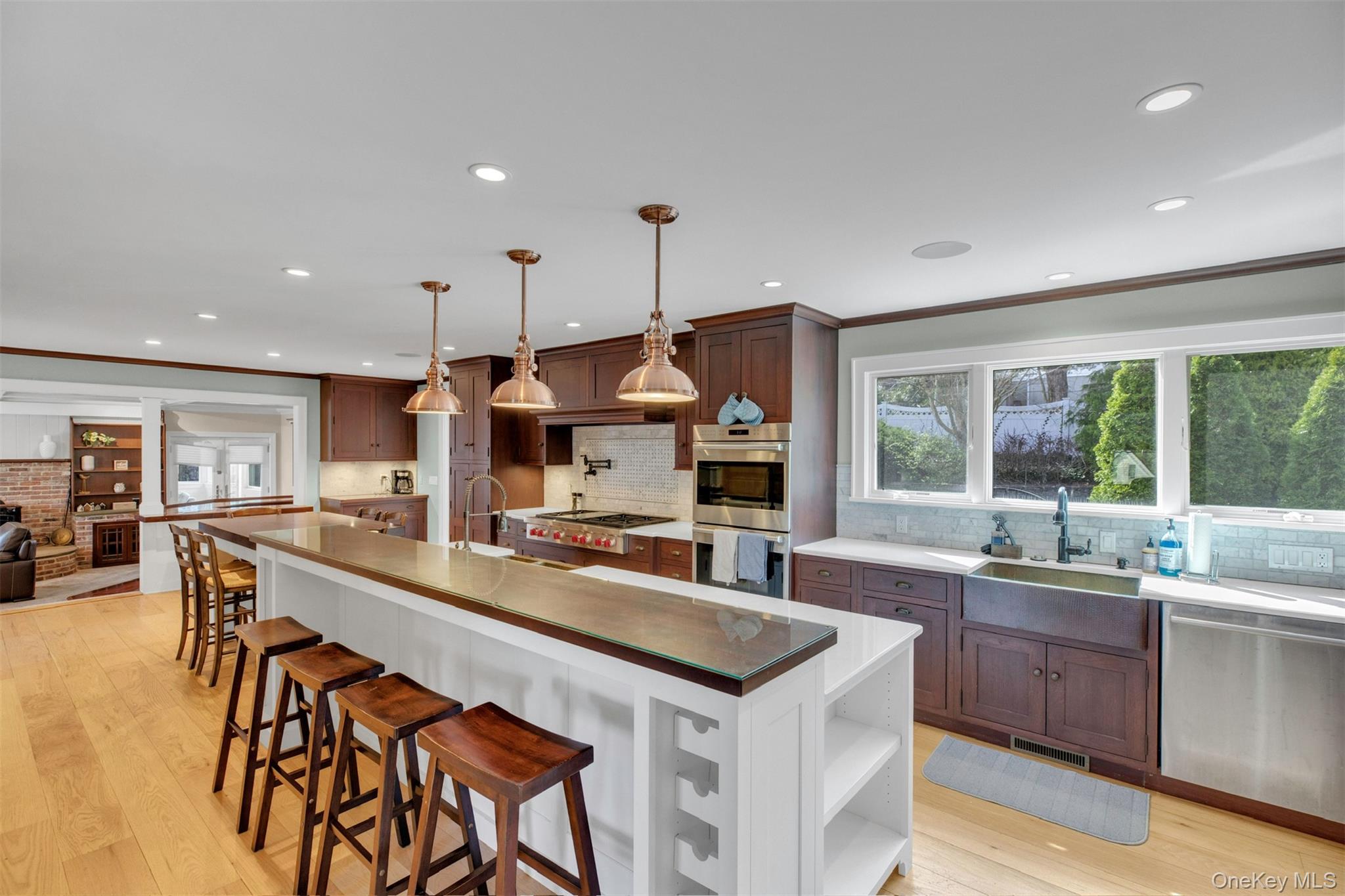 345 Colonial Road Southold, NY 11971 - Photo 9 of 31 a large kitchen with kitchen island a large island in it