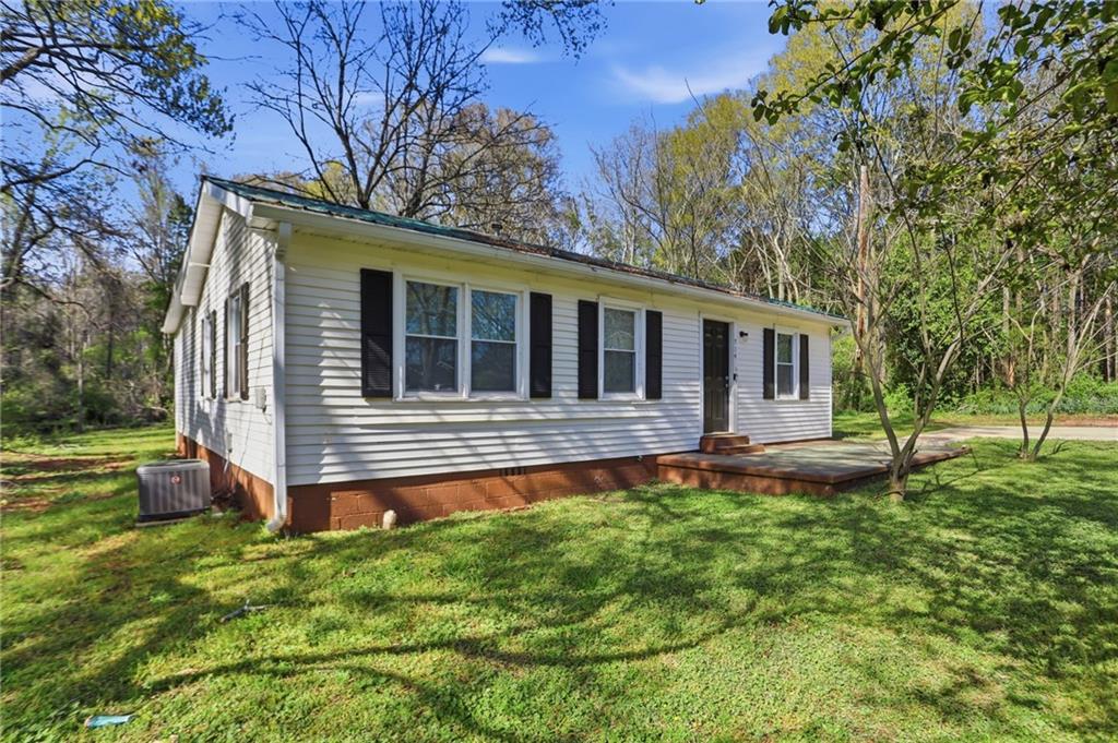 714 Reed Street Monroe, GA 30655 - Photo 2 of 31 a house view with a garden space