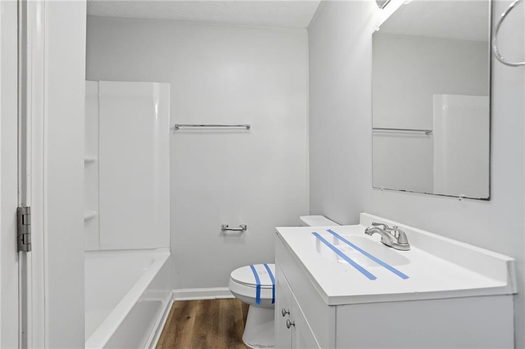 714 Reed Street Monroe, GA 30655 - Photo 21 of 31 a bathroom with a sink a toilet and shower