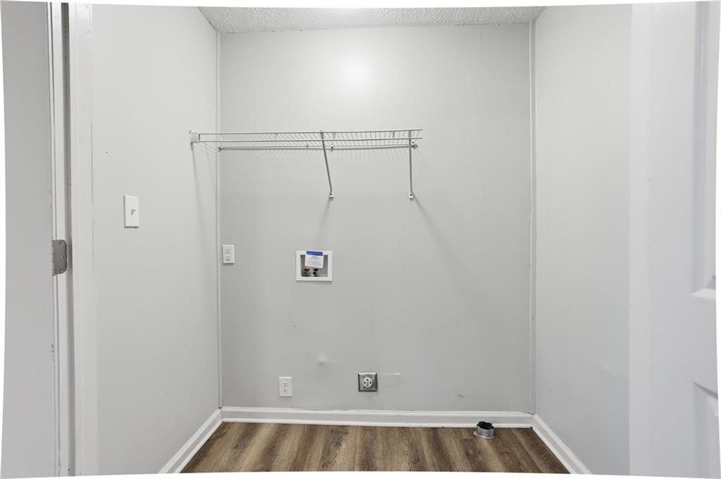 714 Reed Street Monroe, GA 30655 - Photo 24 of 31 a bathroom with a bathtub