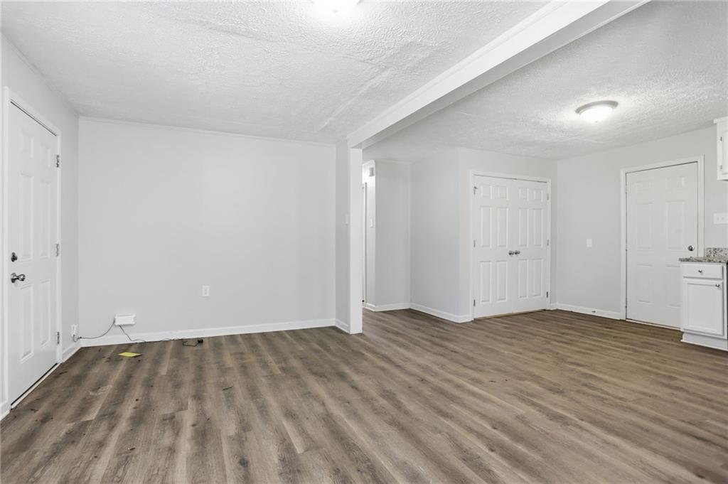 714 Reed Street Monroe, GA 30655 - Photo 25 of 31 a view of an empty room and wooden floor