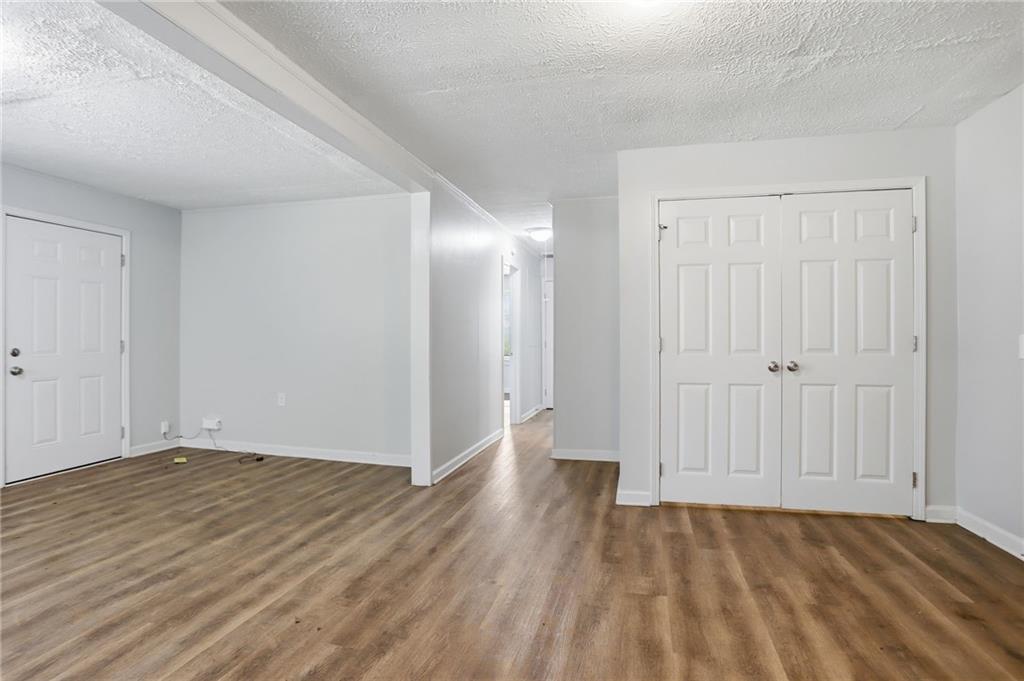 714 Reed Street Monroe, GA 30655 - Photo 26 of 31 a view of an empty room with wooden floor
