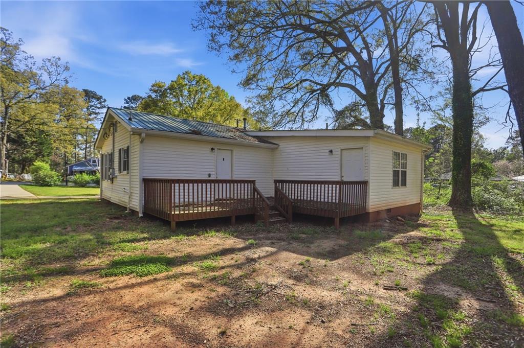 714 Reed Street Monroe, GA 30655 - Photo 27 of 31 a view of a house with a yard and roof