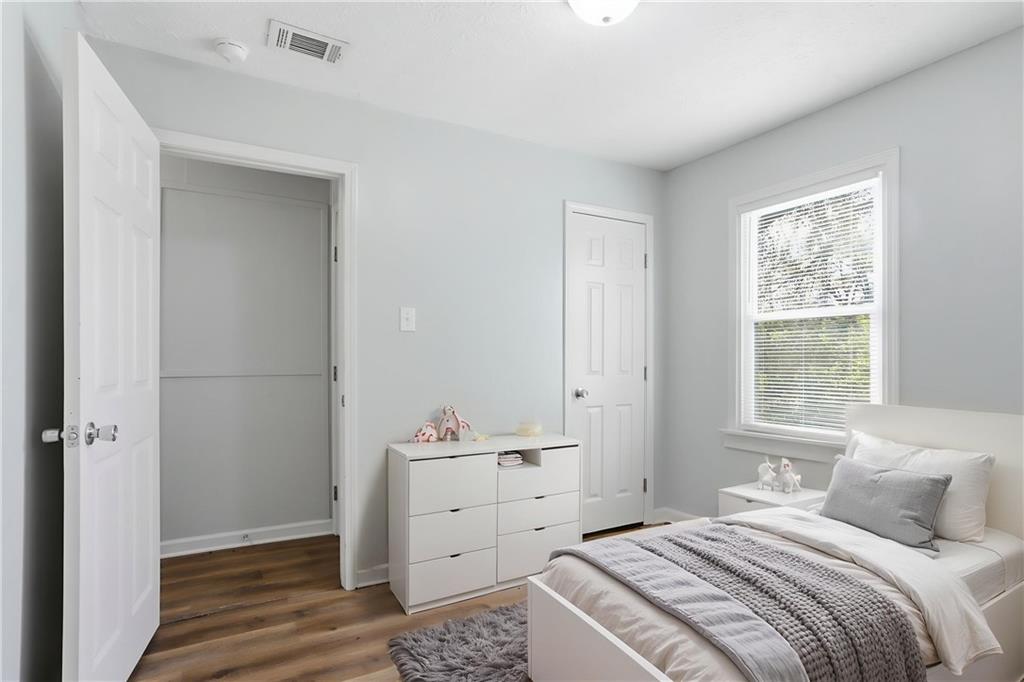 714 Reed Street Monroe, GA 30655 - Photo 7 of 31 a bedroom with a bed and a window