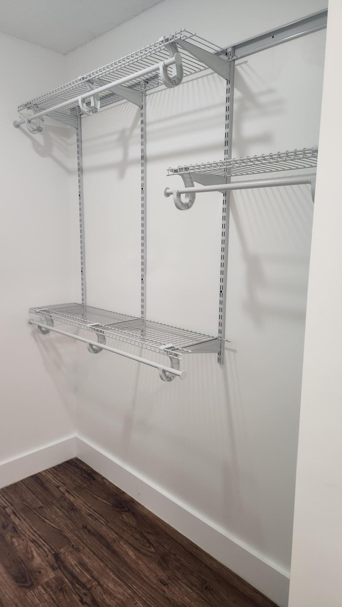 517 Dotterel Road, Unit 31C Delray Beach, FL 33444 - Photo 21 of 31 a view of a room with wooden floor and closet