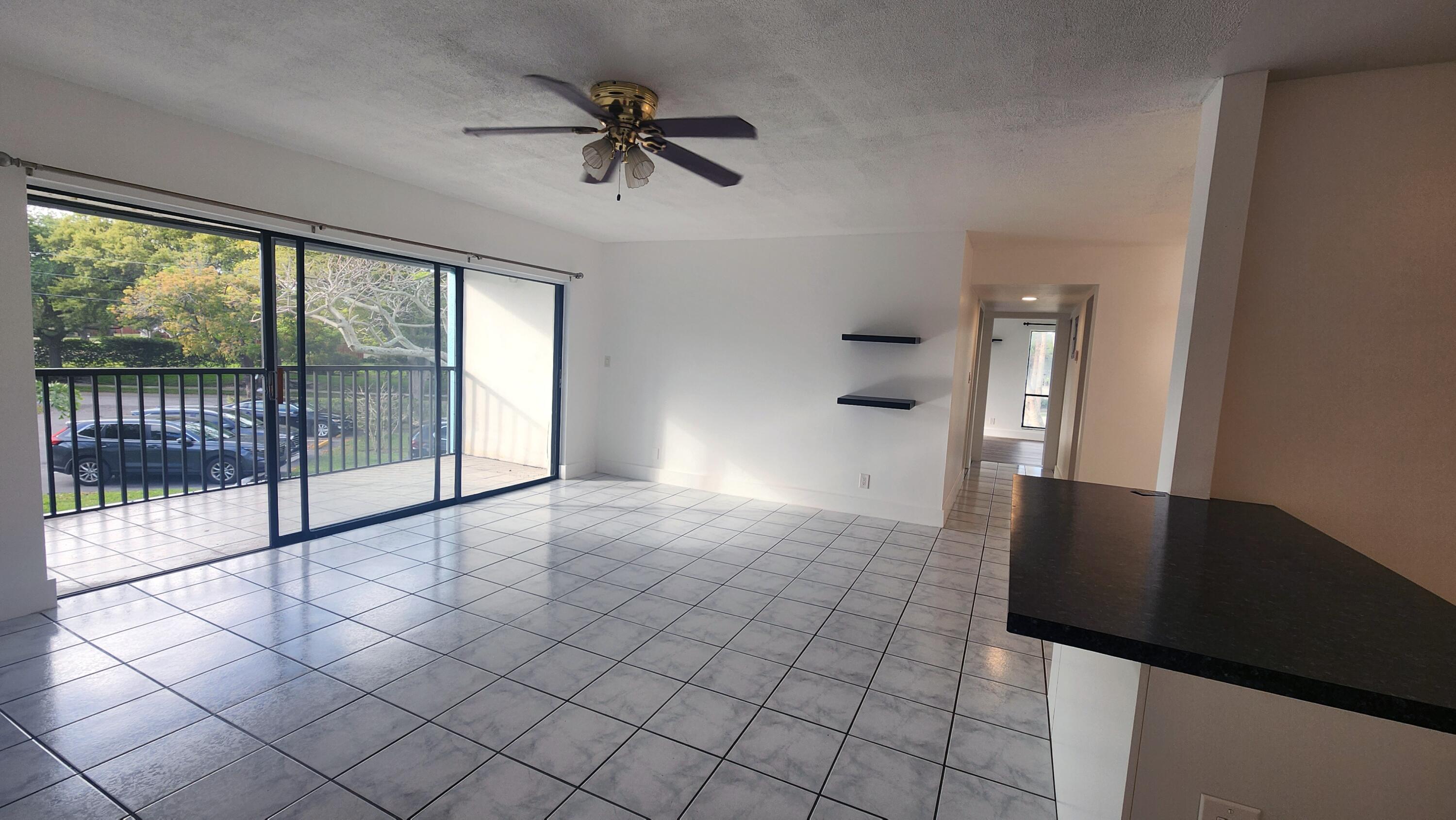 517 Dotterel Road, Unit 31C Delray Beach, FL 33444 - Photo 5 of 31 a view of empty room with windows