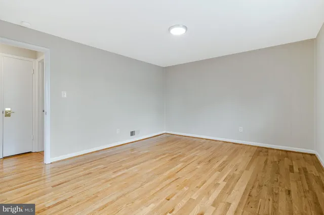a kitchen with cabinets and white appliances